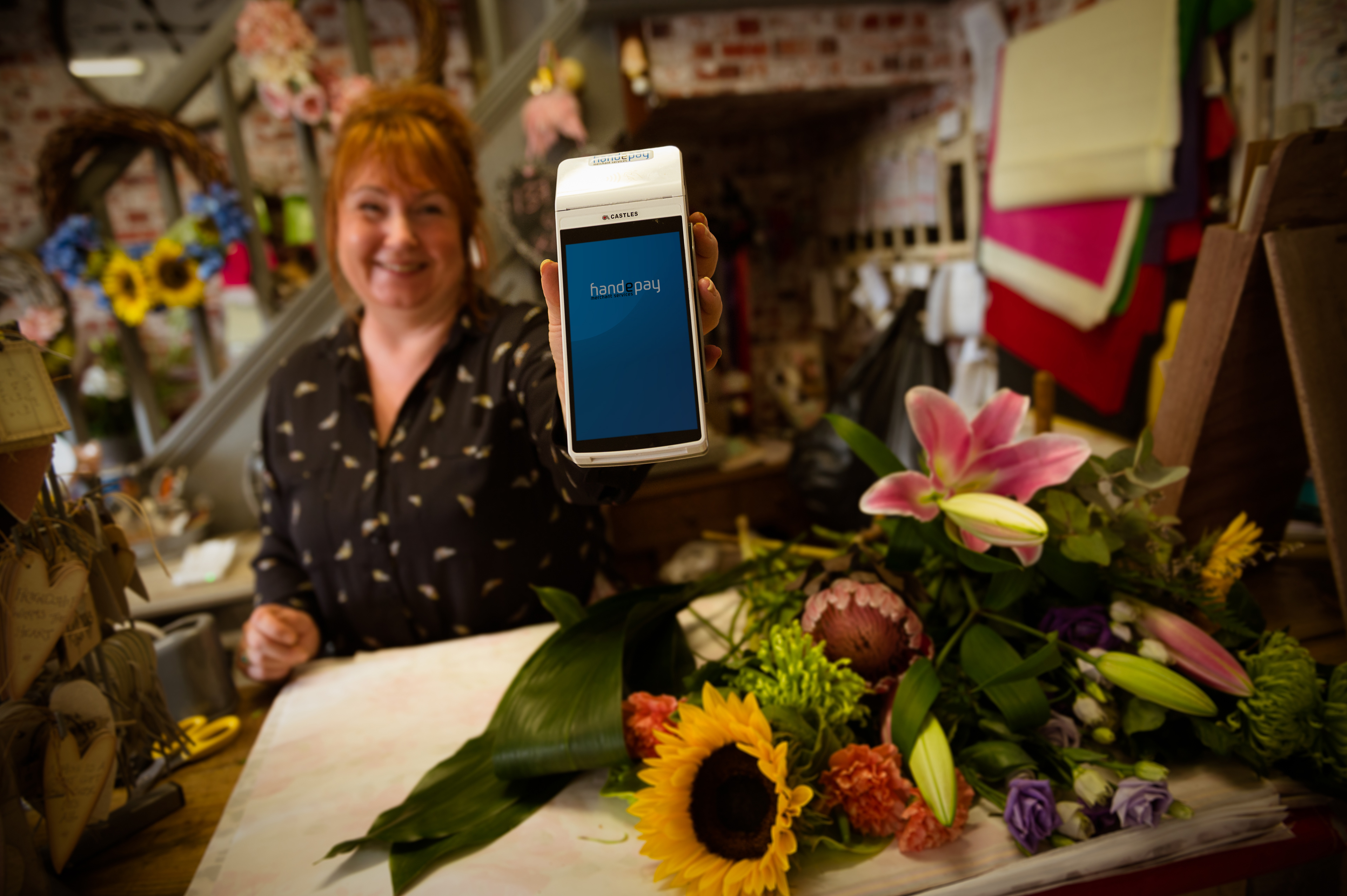 Owner of Lily Pots with card reader machine