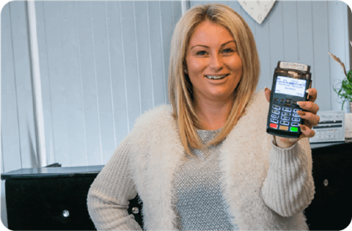 Stacey Hughes from Beauty by Kathryn holding Handepay Card Machine