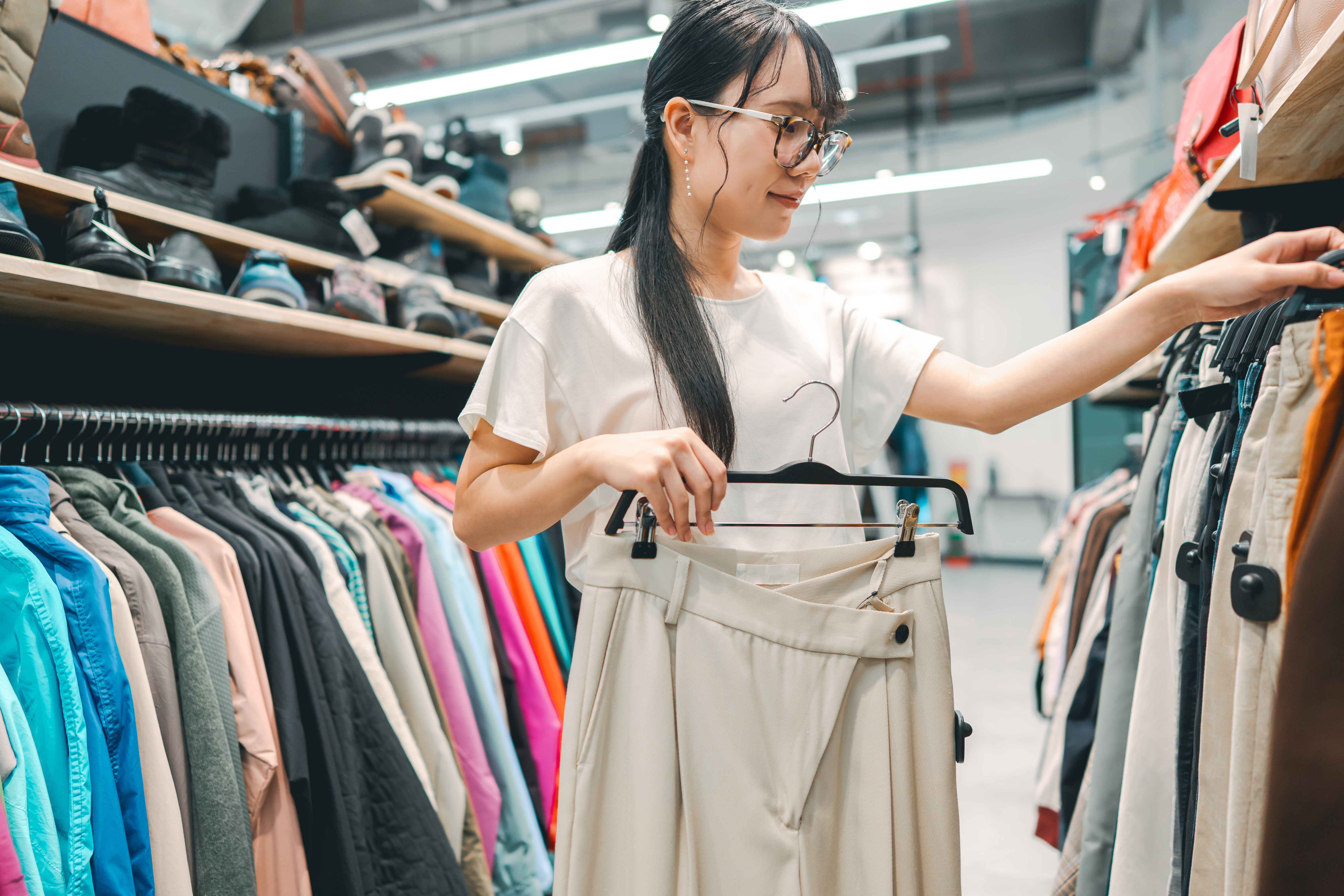 Clothing shop arranging stock