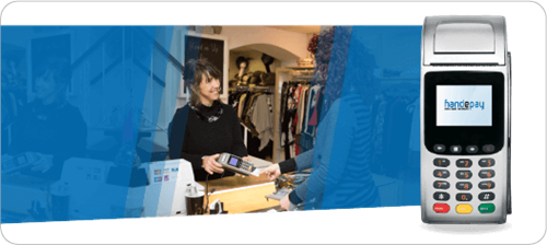 Shop owner using and processing card payment using Handepay's machine