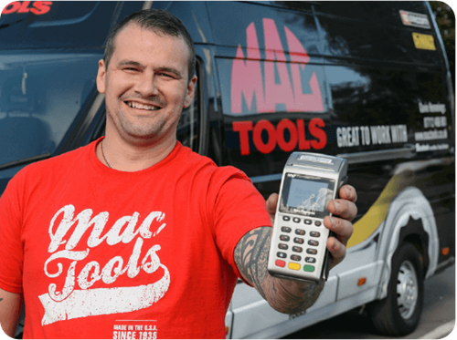 Mac Tools owner holding Handepay Card Payment Mchine