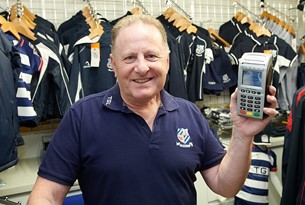 Monty holding Handepay Card Payment Machine