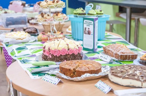 Table of cakes displayed for Macmillan coffee morning