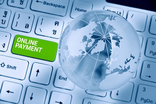 Global on a keyboard with green button of Online Payment