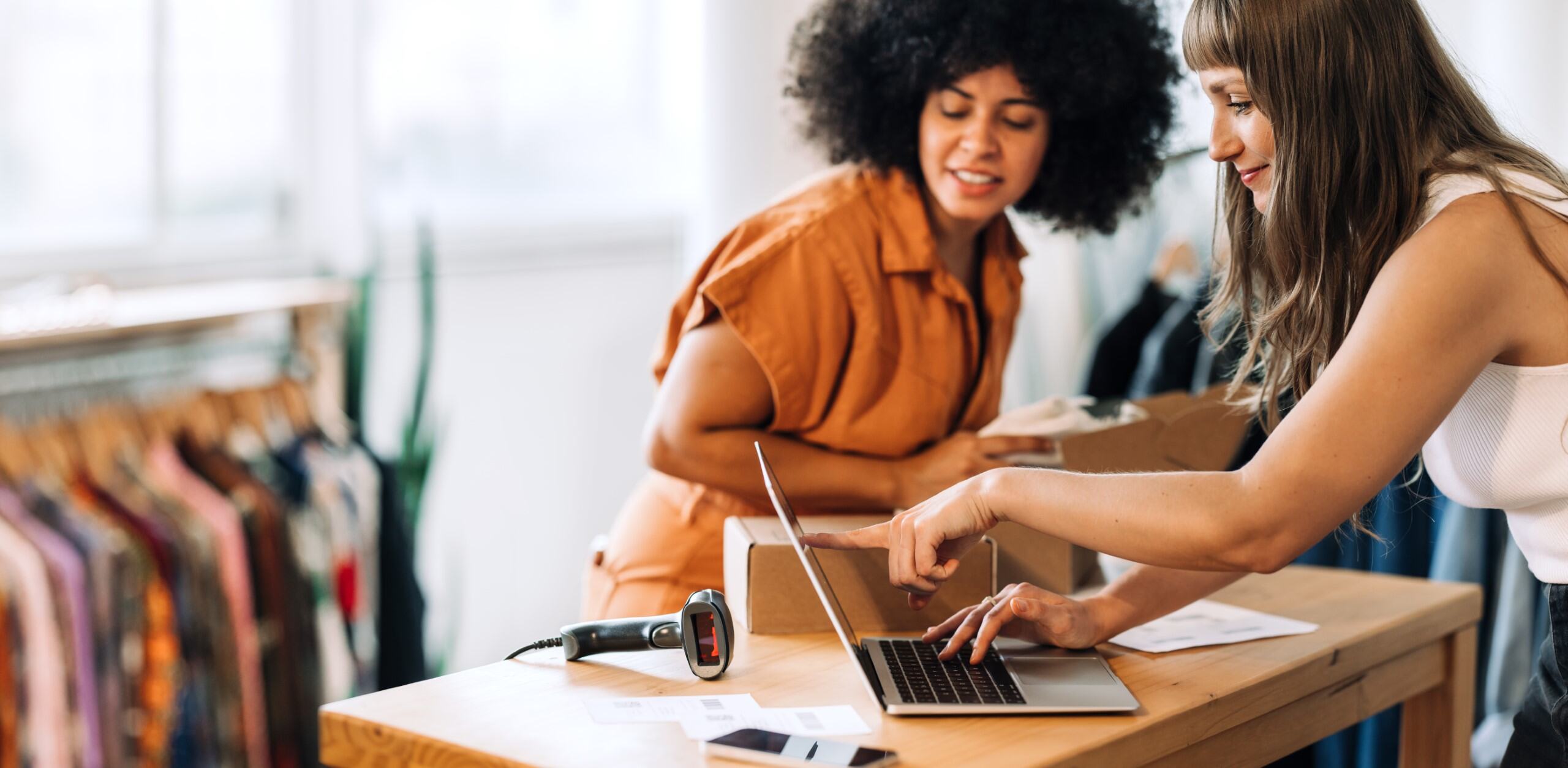 Business owners checking online sales