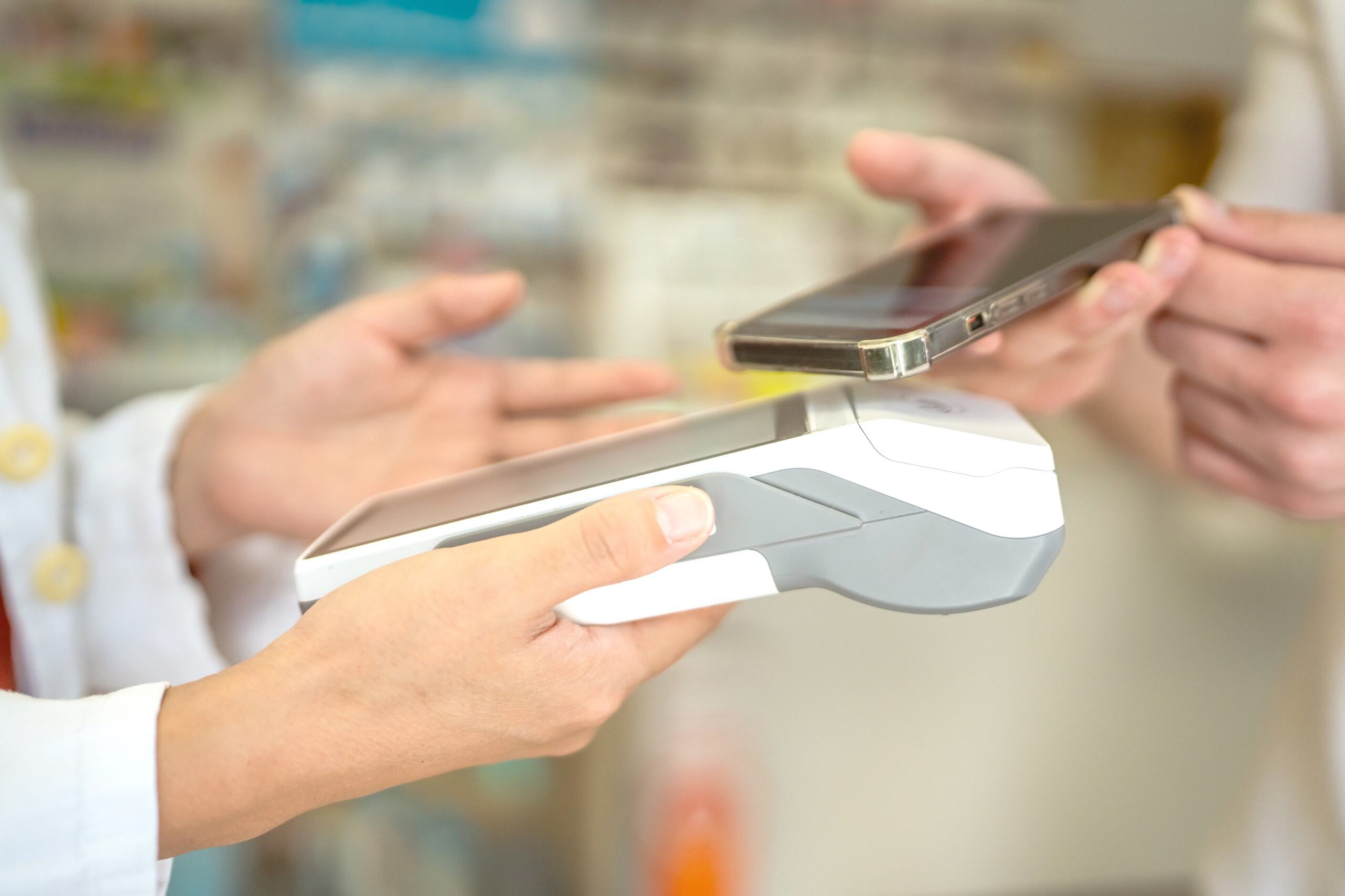 Customer making contactless payment with phone