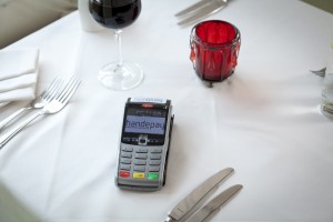 Card payment machine on a table in a restaurant 