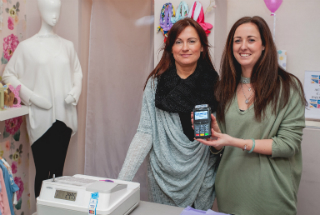 Peaches Boutique staff with Handepay card machine