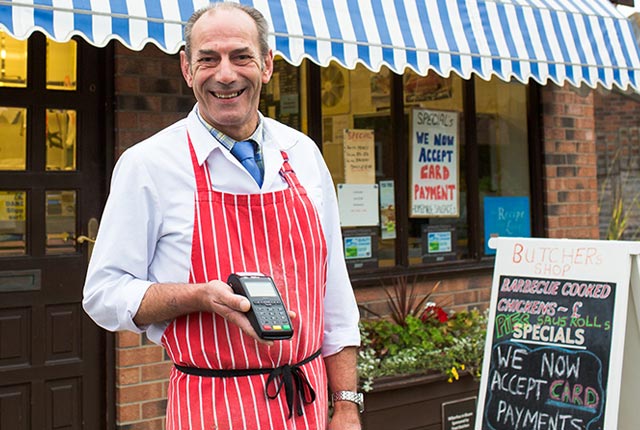 Cliff Frost owner of Frost Butchers holding Handepay Card Payment Machine