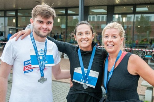 Handepay staff with medals on for St Helens Triathlon