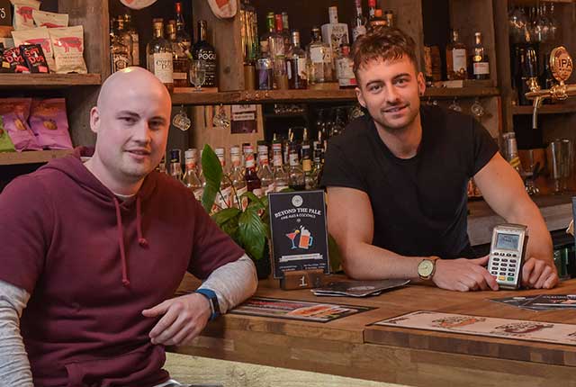 Ben Harrison behind his pub bar where he reduced his company’s credit card transaction fees using Handepay