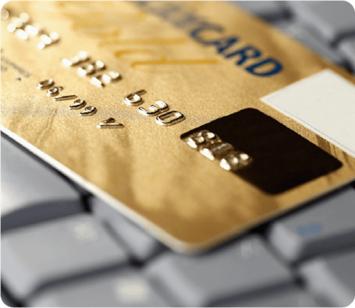 Gold payment card on a keyboard