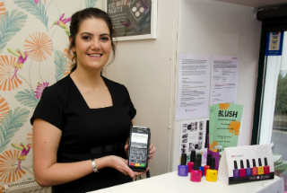 Blush Tanning & Beauty owner with Handepay Card Machine