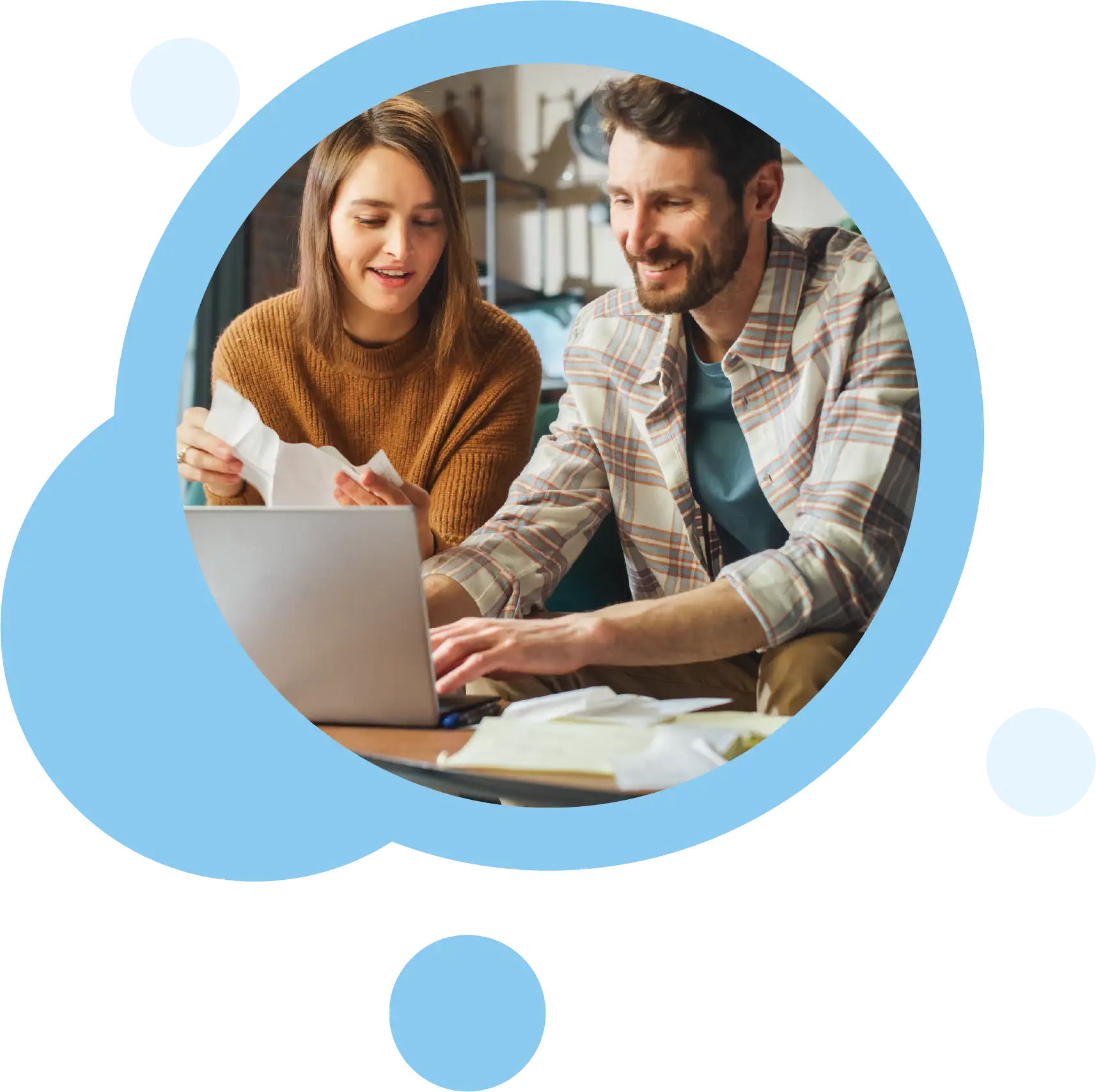 Business owners checking statements at laptop